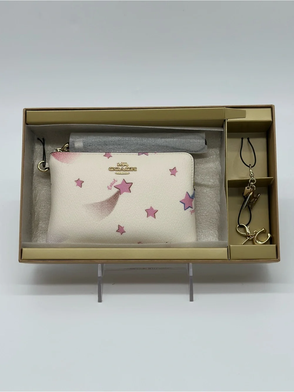 Coach White Wristlet with Pink Star Motif and Gold Charm